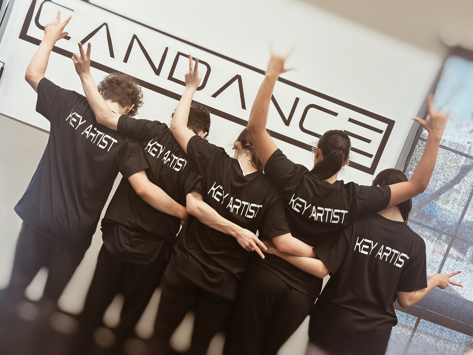 Key Artists posing together in the studio